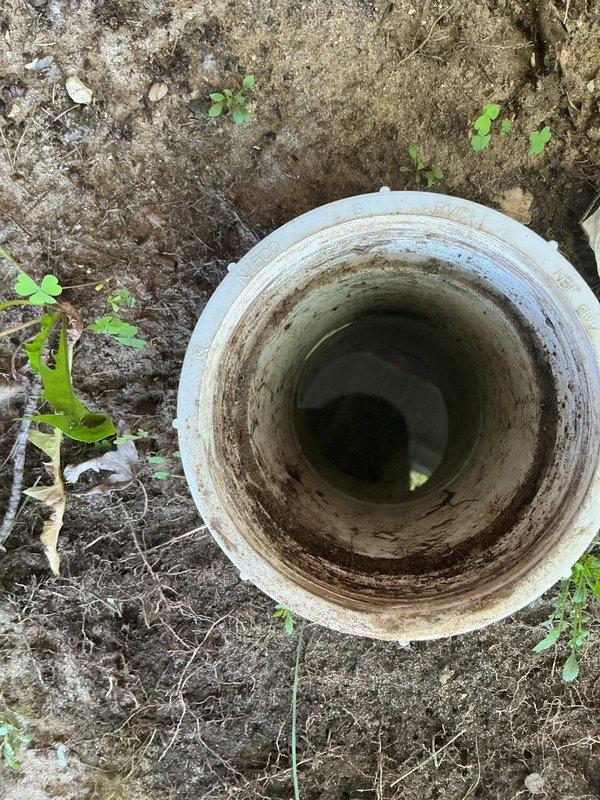 Responded to clogged drain service call and performed diagnostic inspection of the main sewer line. Upon investigation, identified root intrusion as the primary cause of the blockage. Accessed the cleanout opening and documented the condition of the drainage system, revealing significant root penetration within the pipe structure. The trip fee was credited toward the necessary repair work to address the root infiltration issue and restore proper drainage function.