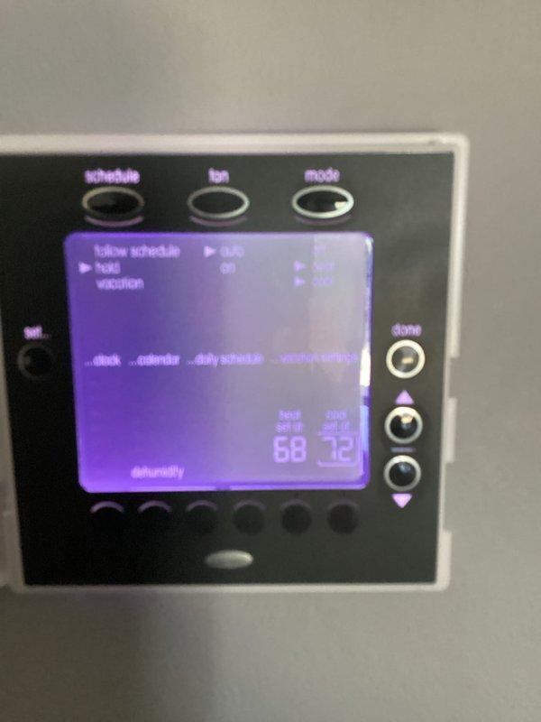 Completed basic monthly cooling maintenance visit on residential HVAC system. Inspected thermostat operation showing proper display function with cooling mode active and temperature differential between setpoint and ambient readings. Documented existing air filtration system with two stacked filters measuring 16x25x4 showing significant dust accumulation and discoloration, indicating filters are due for replacement by customer as they are not included in this service agreement.