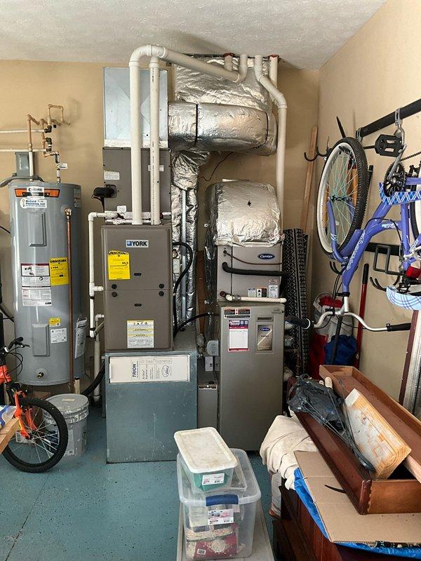 Conducted on-site evaluation for complete replacement of two HVAC systems. Assessed existing equipment including York furnace unit and associated components in utility space. Documented current system configuration, ductwork layout, venting arrangement with PVC piping, and available installation space. Evaluated electrical service capacity and existing infrastructure to determine compatibility with replacement equipment. Provided comprehensive estimate for dual full system replacement with anticipated installation timeline within one month per homeowner requirements.