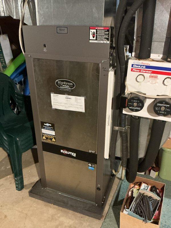 Completed basic monthly cooling maintenance on Hydron Module geothermal heating/cooling system. Inspected geothermal unit, GeoLink control system with Grundfos circulation pumps, refrigerant lines, and ductwork; all components operating within normal parameters. Verified Honeywell programmable thermostat functionality with system maintaining 72°F indoor temperature, replaced 14x30x1 air filter, and confirmed proper system operation.