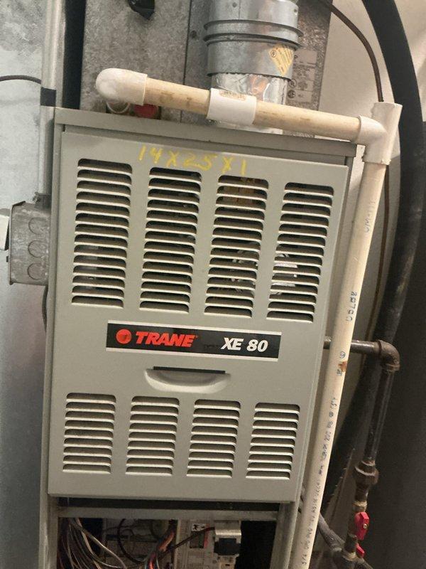 Completed cooling tune-up on residential HVAC system with Trane XE 80 furnace and Orbit digital thermostat. Performed comprehensive maintenance inspection including cleaning condenser coils, checking refrigerant levels, testing electrical connections, verifying proper airflow through ductwork, and confirming thermostat operation displaying 72°F setpoint in cooling mode with auto fan settings. System is operating within manufacturer specifications and ready for the cooling season.