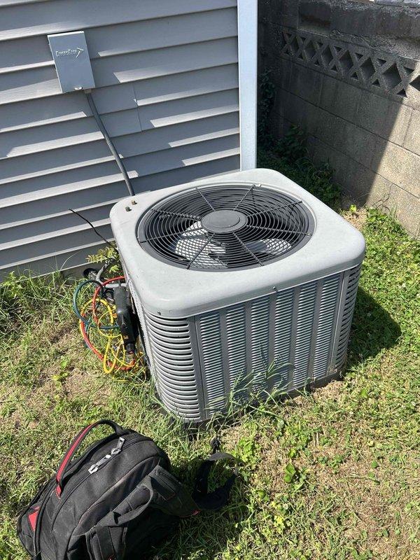 Responded to no cooling complaint on residential A/C unit. Upon arrival, confirmed system was running but not producing cold air with flashing error indicator. Connected refrigerant manifold gauges to outdoor condenser unit and performed diagnostic pressure and temperature readings to assess system performance. Identified cooling system malfunction requiring further troubleshooting of refrigerant charge levels and component operation.