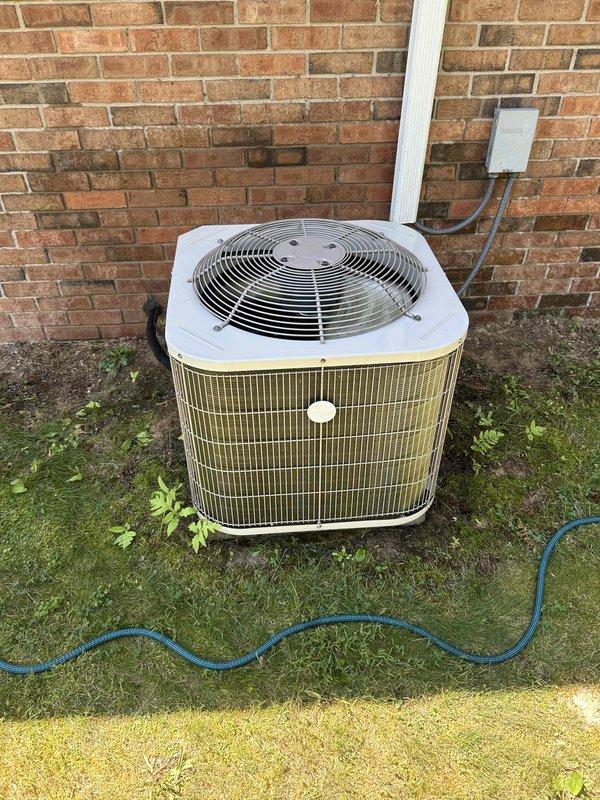 Responded to service call for water leakage from HVAC unit. Inspected outdoor condenser unit and found condensate drainage issue. Cleared condensate drain line obstruction, verified proper drainage flow, and tested system operation. Confirmed thermostat functioning correctly with unit cooling properly to setpoint of 69°F. System operating within normal parameters with no further leakage observed upon completion.