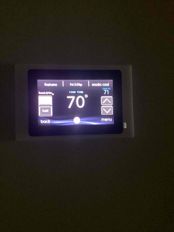 Completed annual cooling maintenance on two HVAC systems. Performed comprehensive inspection of both units including condenser coil cleaning, refrigerant pressure checks, electrical component testing, and airflow verification. Verified thermostat operation showing system maintaining 70°F room temperature in cooling mode with 23% relative humidity. Inspected ductwork assembly and air handler unit in basement mechanical room, confirming proper installation and connections. All systems operating within manufacturer specifications. Customer requires 30x32x2 filter (not included in service). Maintenance agreement renewed through 5/4/2027.