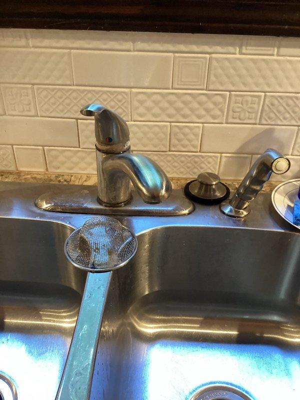 Responded to service call for multiple plumbing concerns including a leaking hydrant, kitchen sink leak, and downstairs bathtub drain plug replacement. Conducted thorough inspection of kitchen sink plumbing system, examining P-trap assembly, garbage disposal connections, supply lines, and drainage components for sources of leakage. Verified all slip-joint fittings and connections under sink were secure and functioning properly. Assessed bathtub drain plug issue that was previously identified but not addressed due to lack of replacement parts on hand during prior visit.