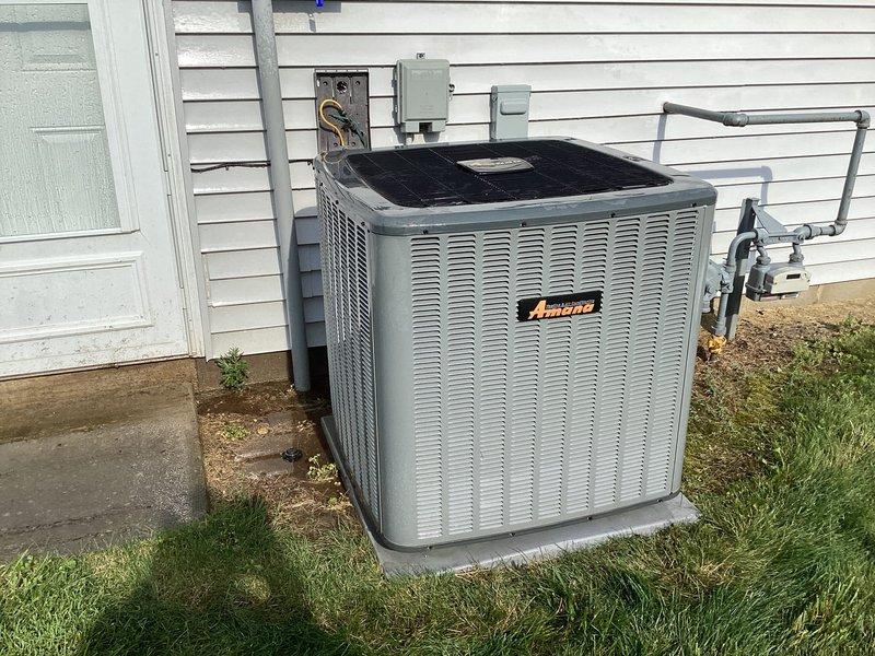 Completed comprehensive cooling tune-up and preventive maintenance on residential Amana air conditioning system. Performed standard inspection of outdoor condenser unit including electrical connections, refrigerant levels, and component operation. Interior blower assembly showed significant dust and debris accumulation on blower wheel and motor housing, which was documented for future cleaning consideration. All electrical connections verified secure, disconnect box operational, and refrigerant lines properly insulated. System tested and confirmed operational within normal parameters.