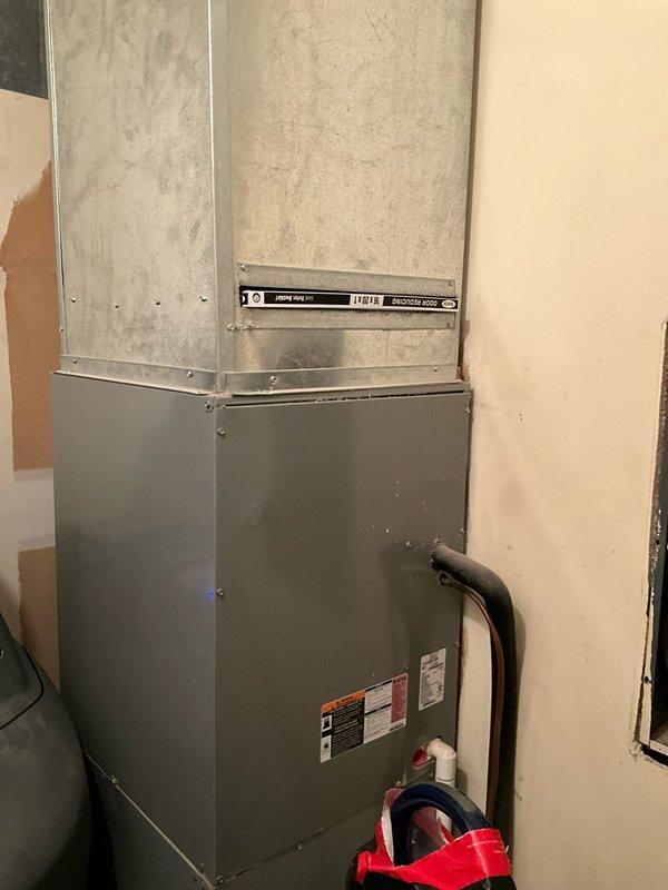Responded to service call for breaker tripping issue and diagnosed catastrophic compressor failure when pin blew out of the compressor during troubleshooting. Assessed existing HVAC system including indoor air handler unit located in basement utility area and outdoor condensing unit. Provided comprehensive replacement estimates for both full system replacement and outdoor unit only options, with customer requesting expedited installation timeline.