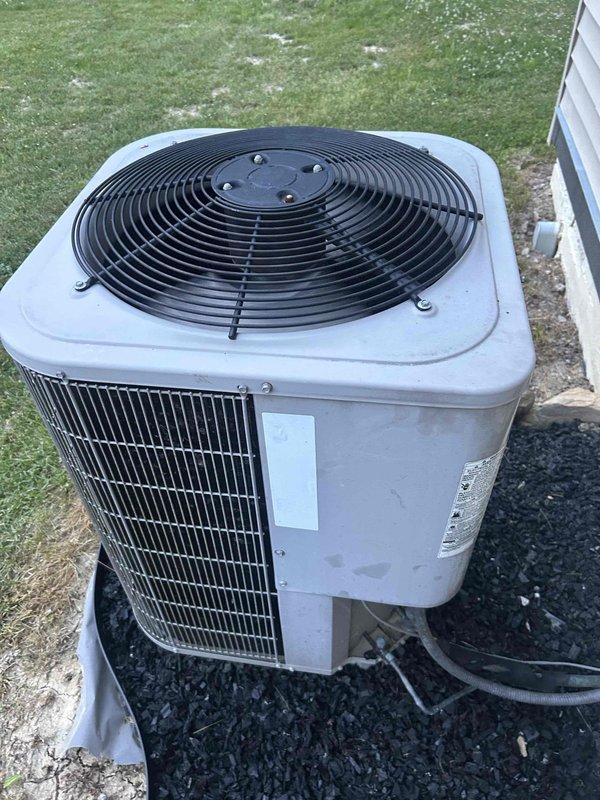 Responded to no cooling complaint on residential air conditioning system. Performed diagnostic evaluation of outdoor condenser unit showing signs of age and wear. Inspected condenser coils, fan assembly, and electrical components to identify cause of cooling failure on aging equipment exceeding ten years of service.