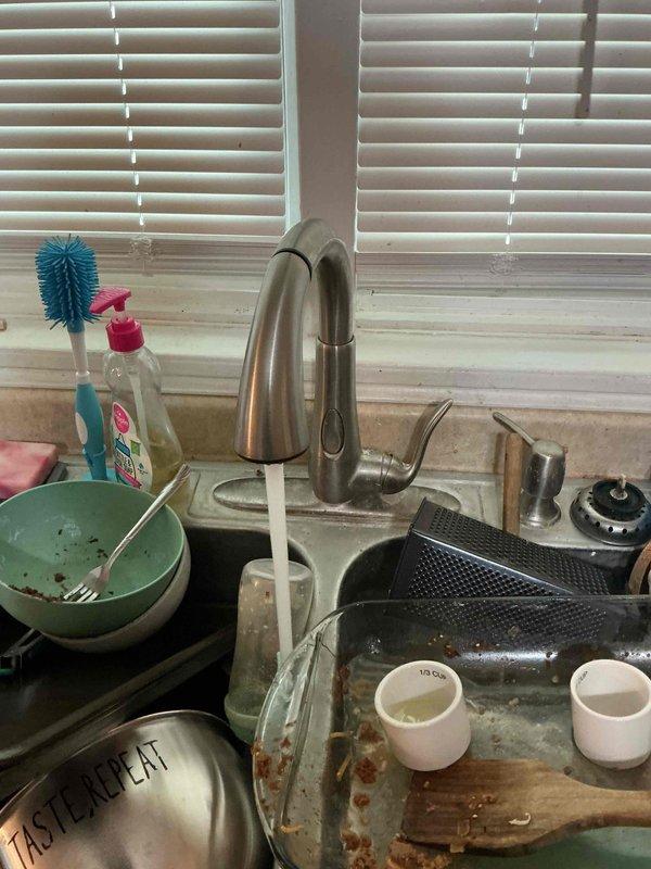 Completed monthly plumbing inspection as part of recurring maintenance membership. Thoroughly examined kitchen sink plumbing system, including chrome faucet assembly with side sprayer attachment, and inspected bathroom shower system featuring rainfall showerhead, flexible supply hoses, mixing valve, and wall-mounted fixtures. All plumbing components found to be in proper working order with no leaks, corrosion, or operational issues detected.