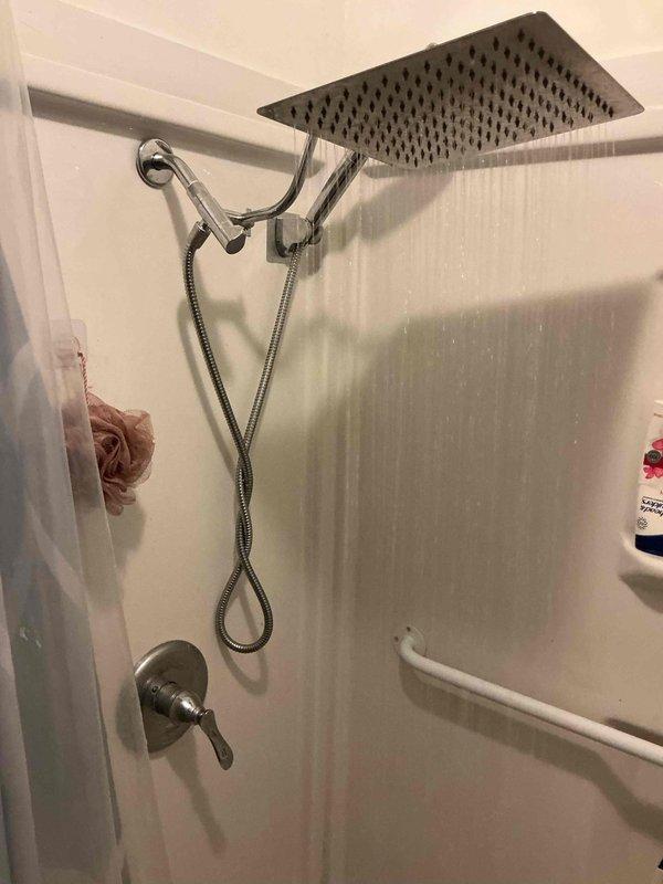 Completed monthly plumbing inspection as part of recurring maintenance membership. Thoroughly examined kitchen sink plumbing system, including chrome faucet assembly with side sprayer attachment, and inspected bathroom shower system featuring rainfall showerhead, flexible supply hoses, mixing valve, and wall-mounted fixtures. All plumbing components found to be in proper working order with no leaks, corrosion, or operational issues detected.