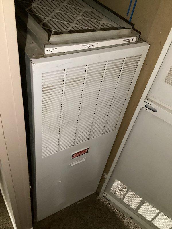 Performed routine HVAC maintenance on the second cooling system, accessing the air handler unit located in the utility closet. Replaced the existing 20 x 20 x 1 pleated air filter with a new standard-efficiency filter, ensuring proper airflow direction as indicated by unit markings. Verified filter housing integrity and confirmed secure installation of replacement filter in the horizontal air handler configuration.