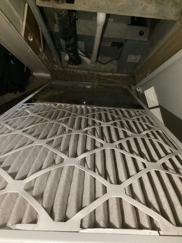 Performed routine HVAC maintenance on the second cooling system, accessing the air handler unit located in the utility closet. Replaced the existing 20 x 20 x 1 pleated air filter with a new standard-efficiency filter, ensuring proper airflow direction as indicated by unit markings. Verified filter housing integrity and confirmed secure installation of replacement filter in the horizontal air handler configuration.