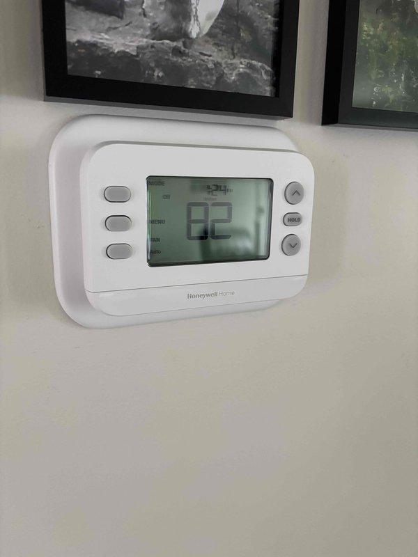 Completed full HVAC system installation including Lennox air conditioning unit and furnace. Installed new Honeywell Home digital thermostat with LCD display and programmed system settings. Verified proper system operation with supply air temperature reading of 68.7°F at startup, confirming equipment is functioning within normal parameters.