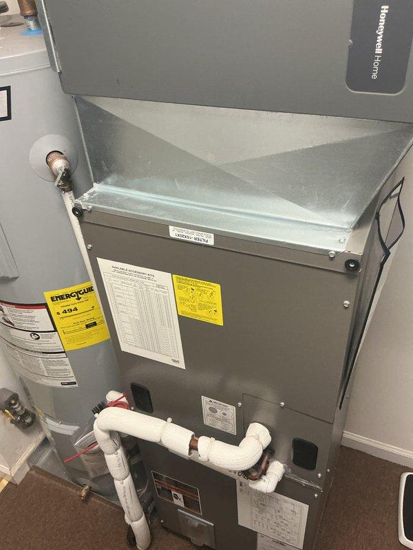 Completed monthly HVAC maintenance on cooling system including inspection of air handler unit with Honeywell Home controls and associated components. Performed refrigerant pressure diagnostics using Yellow Jacket manifold gauge set, verifying system pressures within manufacturer specifications. Replaced 20x20x4 air filter, inspected condensate drainage system with PVC piping configuration, and confirmed all equipment labels and safety placards remain intact and legible for proper system identification.