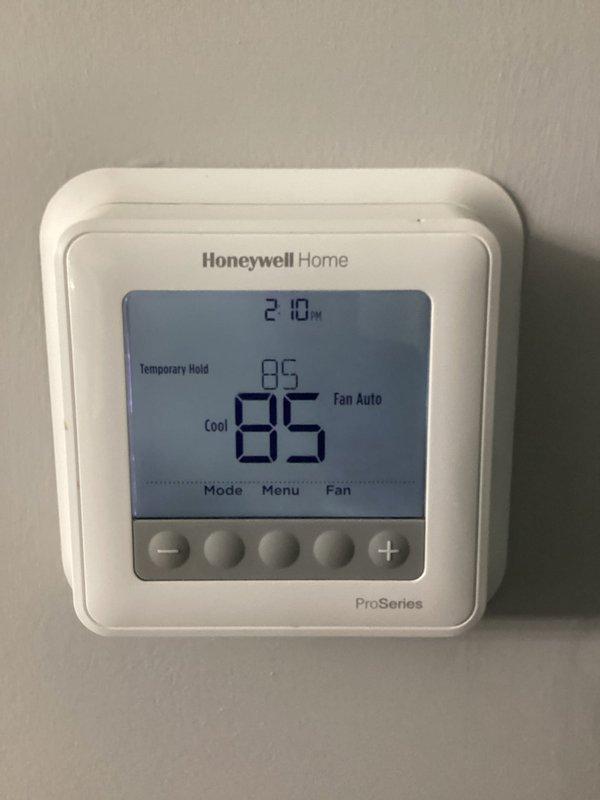 Responded to no cooling complaint on 2022 installation. Upon inspection, discovered extensive corrosion and deterioration of refrigerant lines and internal components, with severely oxidized copper tubing, compromised electrical connections, and debris accumulation inside the unit. Thermostat was functioning and set to cooling mode at 85 degrees, but system unable to operate due to catastrophic component failure requiring immediate equipment replacement.