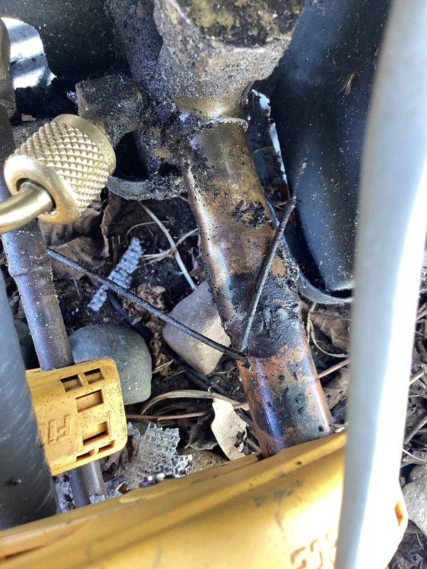 Responded to no cooling complaint on 2022 installation. Upon inspection, discovered extensive corrosion and deterioration of refrigerant lines and internal components, with severely oxidized copper tubing, compromised electrical connections, and debris accumulation inside the unit. Thermostat was functioning and set to cooling mode at 85 degrees, but system unable to operate due to catastrophic component failure requiring immediate equipment replacement.