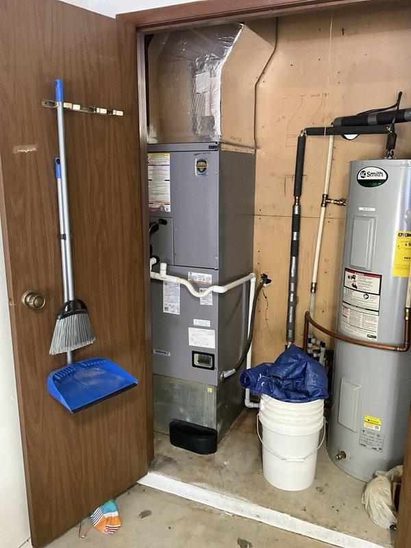 Conducted site assessment for ductwork relocation project in condominium unit, evaluating feasibility of converting existing underground duct system to overhead ceiling installation. Inspected current HVAC configuration including furnace/air handler unit in mechanical closet and exterior condenser unit, documented existing flexible ducting connections, and photographed equipment layout to develop comprehensive estimate for ductwork modification similar to neighboring units.