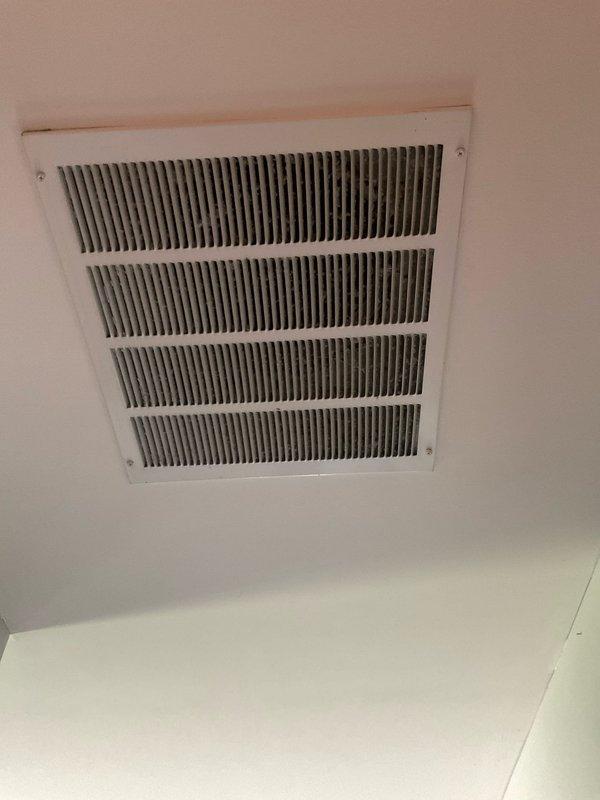 Performed comprehensive duct and dryer vent cleaning service at residential property. Upon inspection, discovered severely compromised air filter with significant structural damage, including large tear in filtration media and extensive accumulation of dust, debris, and lint indicating extended service life without replacement. Cleaned ceiling-mounted return air grille and accessible ductwork, removing accumulated contaminants from louvers and interior passages. Documented pre-service conditions showing filter deterioration and contamination levels. Recommended immediate filter replacement to restore proper airflow and system efficiency.
