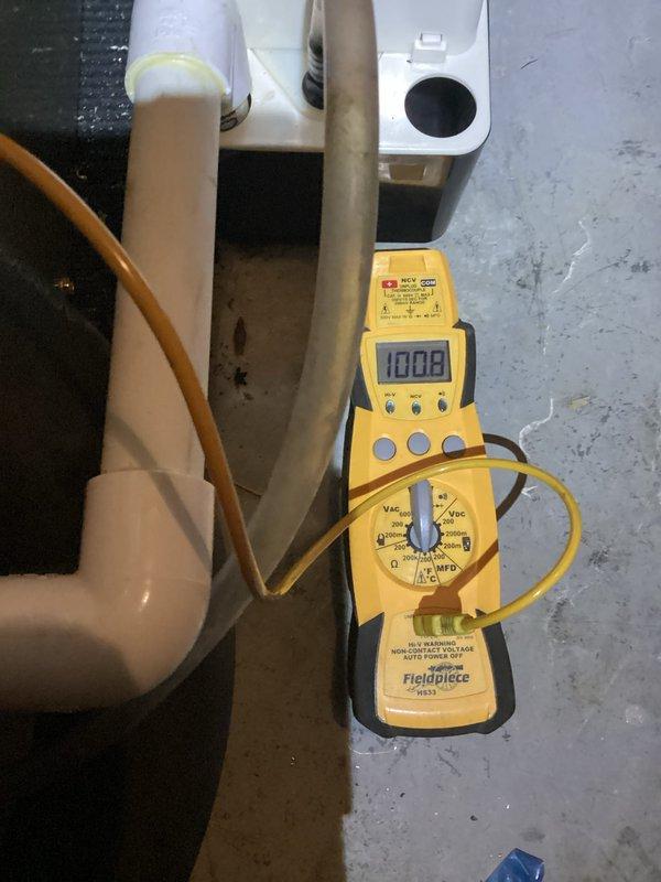 Responded to warranty call for geothermal system installed in December with temperature differential issue—thermostat set to 72°F but house temperature reading 77°F. Performed diagnostic testing using digital multimeter to verify system operation and electrical parameters. Inspected geothermal heat pump unit, condensate pump assembly, and associated piping connections. Documented equipment conditions and system performance with photos for warranty records.