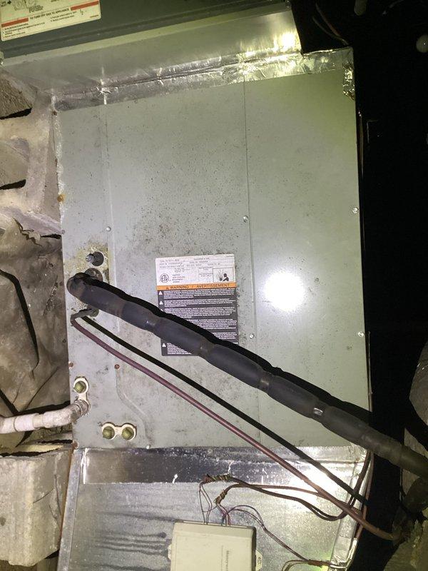 Responded to no cooling call on residential HVAC system. Upon arrival, found thermostat displaying 81°F actual temperature with setpoint at 77°F, indicating system was not maintaining desired temperature. Inspected attic-mounted air handler unit and observed refrigerant line set and electrical connections. Diagnosed and resolved issue, restoring proper system operation and cooling functionality.