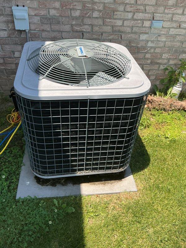 Completed comprehensive preventive maintenance on 12-year-old residential heating and cooling system. Performed full AC tune-up including inspection of outdoor condenser unit, verified proper operation of top-mounted fan and protective grille, checked refrigerant levels, cleaned coils, and inspected all electrical connections. Evaluated indoor furnace components including heat exchanger and blower assembly, confirmed all safety controls functioning properly, and verified system airflow. Unit operating within manufacturer specifications with no immediate repairs needed. Confirmed contact information and documented system condition with photos for maintenance records.
