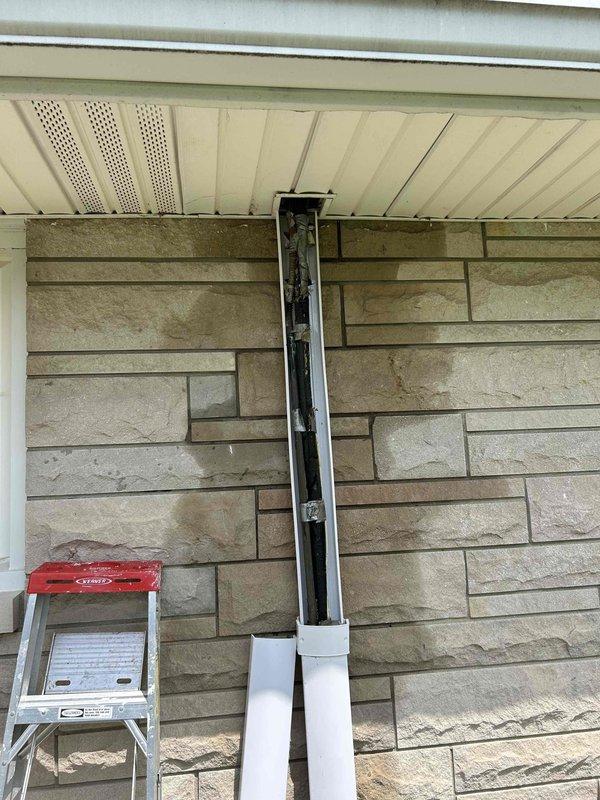 Completed warranty inspection on recent HVAC installation addressing concerns regarding exterior condensation discharge. Verified condensate drain line routing and proper termination at exterior wall, ensuring adequate drainage away from building foundation. Inspected attic space to confirm proper installation of flexible ductwork, verified adequate insulation coverage around HVAC components, and documented all system components operating within manufacturer specifications.