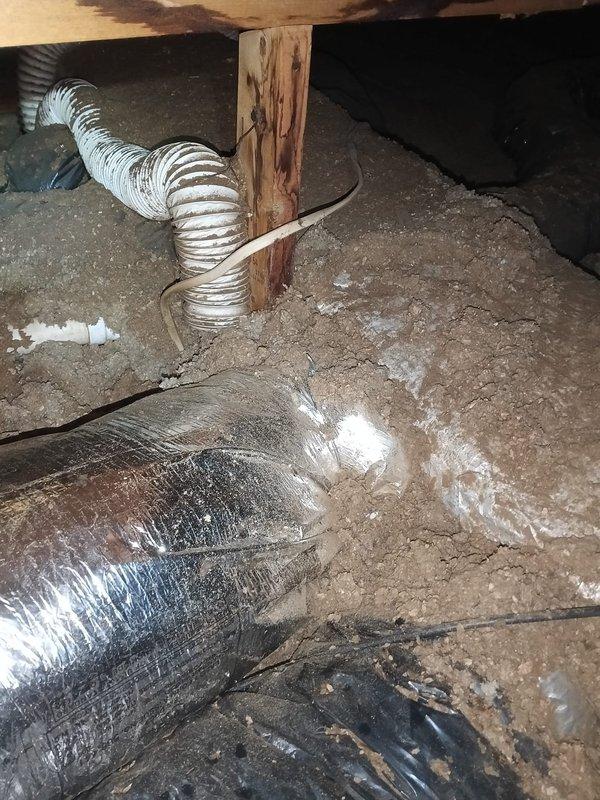 Completed HVAC installation work in crawl space to improve indoor air quality and system performance. Upsized existing ventilation ductwork and installed new return air duct using flexible metallic ductwork with proper support and routing around structural posts. All ductwork was properly sealed and insulated to prevent air leakage and maintain system efficiency in the unconditioned space.