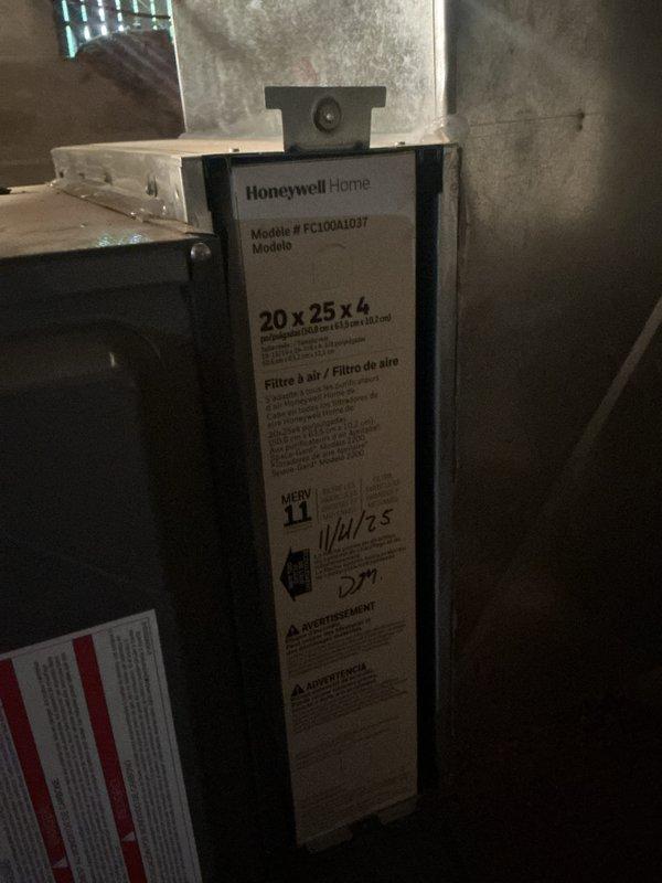 Completed routine HVAC maintenance and cooling system inspection. Installed new Honeywell Home 20x25x4 air filter (model FC100A1037) in the air handler unit and verified thermostat operation showing proper temperature readings at 70°F with setpoint at 72°F. System is operating within normal parameters and maintenance contract renewed through April 2027.