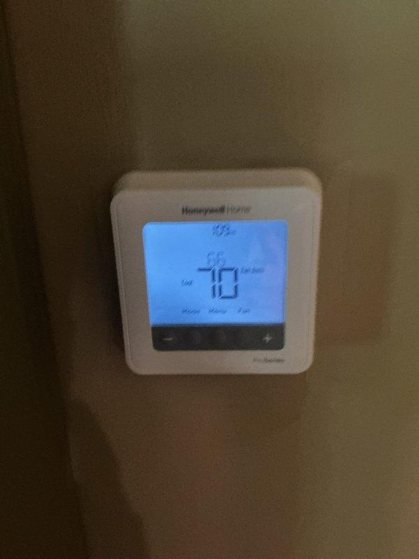 Completed routine HVAC maintenance and cooling system inspection. Installed new Honeywell Home 20x25x4 air filter (model FC100A1037) in the air handler unit and verified thermostat operation showing proper temperature readings at 70°F with setpoint at 72°F. System is operating within normal parameters and maintenance contract renewed through April 2027.