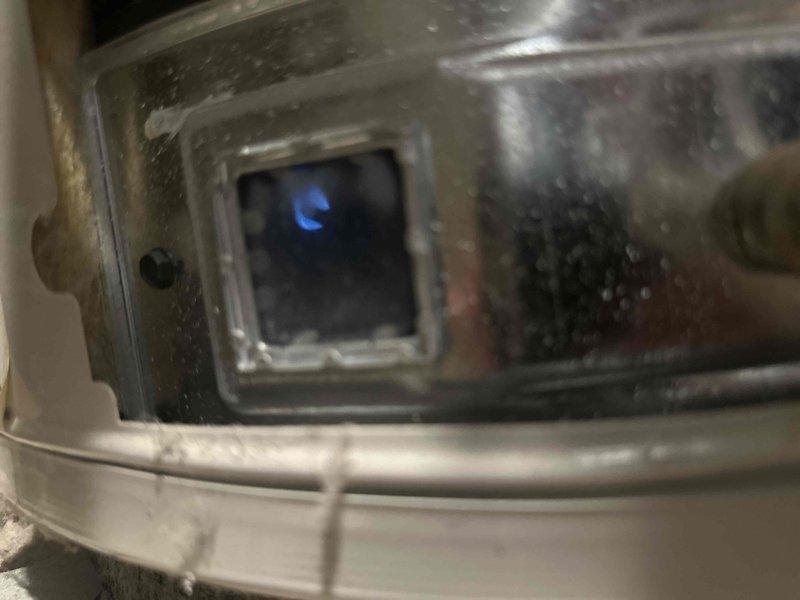 Responded to no hot water complaint following same-day water heater installation. Upon arrival, found pilot light had extinguished after initial lighting attempt. Successfully relit pilot light assembly, verified proper ignition sequence, and confirmed burner operation through viewing port with visible blue flame. Tested hot water delivery at fixtures to ensure system functionality before departure.