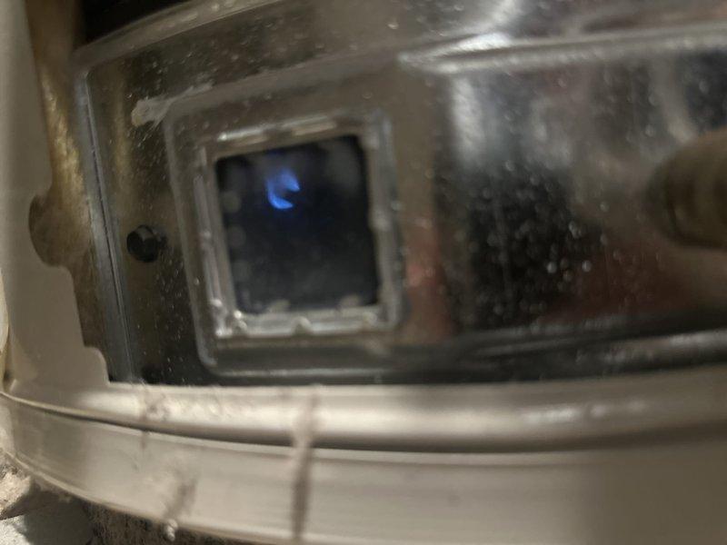 Responded to no hot water complaint following same-day water heater installation. Upon arrival, found pilot light had extinguished after initial lighting attempt. Successfully relit pilot light assembly, verified proper ignition sequence, and confirmed burner operation through viewing port with visible blue flame. Tested hot water delivery at fixtures to ensure system functionality before departure.