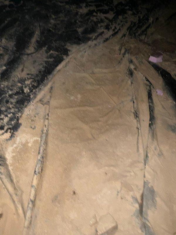 Conducted inspection of crawl space ducting and mechanical systems. Documented existing conditions including insulated ductwork with visible aging and dust accumulation, PEX plumbing lines with brass fittings, hydronic system components, and mechanical equipment installation beneath floor joists.