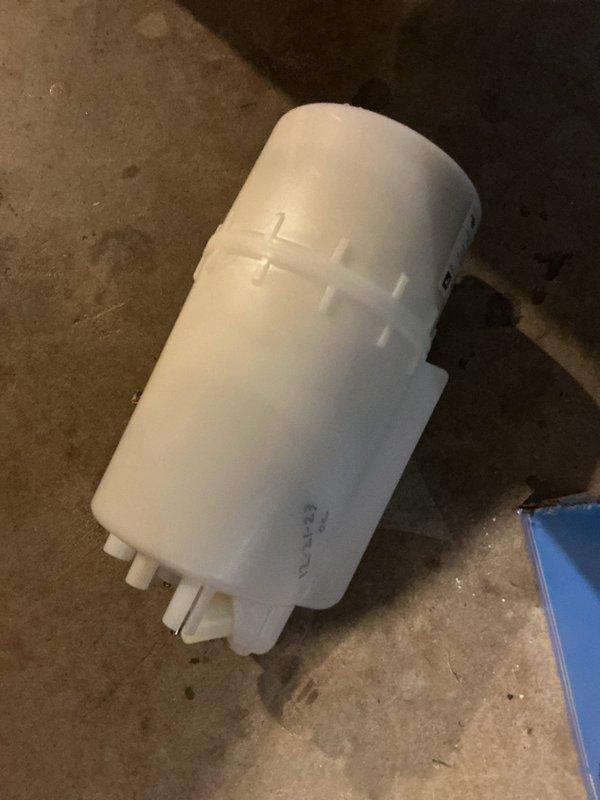 Completed installation of replacement humidifier canister and 20x20x4 air filter. The new canister was properly mounted to the existing bracket assembly with secure pipe connections and fittings, ensuring proper water flow to the humidification system.