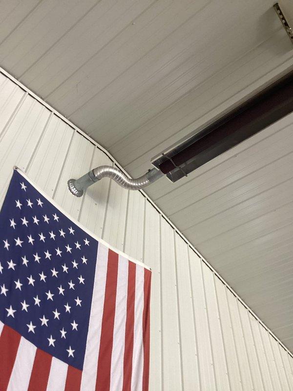 Completed trouble call for detached pole barn structure with compromised HVAC ventilation system. Multiple outlet vents had become dislodged from flexible aluminum ductwork running along upper wall/ceiling area, creating openings that allowed pest intrusion. Documented existing conditions showing exposed ductwork and missing vent terminations on both interior and exterior building surfaces. Provided estimate for reinstallation and securing of displaced vents to restore proper system integrity and prevent further wildlife entry.