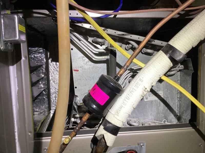 Completed cooling maintenance service on Carrier air conditioning system. Performed comprehensive inspection of indoor evaporator coil assembly and refrigerant lines, verified proper installation of service tags and component identification markers. Inspected outdoor condenser unit, confirmed operational condition of fan assembly and housing, noted unit positioned on proper concrete pad with adequate clearance. System components including copper refrigerant lines, electrical connections, and ductwork inspected and found in serviceable condition. Customer has active maintenance agreement renewing 10/23/26; standard 16x25x4 filter size not included in service agreement.