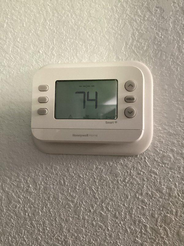 Completed annual cooling maintenance on vertical HVAC unit installed in closet configuration. Performed comprehensive system inspection including checking refrigerant levels, cleaning condenser coils, testing thermostat operation (Honeywell Home digital unit reading 74°F), verifying airflow through louvers, and replacing 16x20x1 air filter. All components functioning properly with no issues identified during routine preventative maintenance visit.