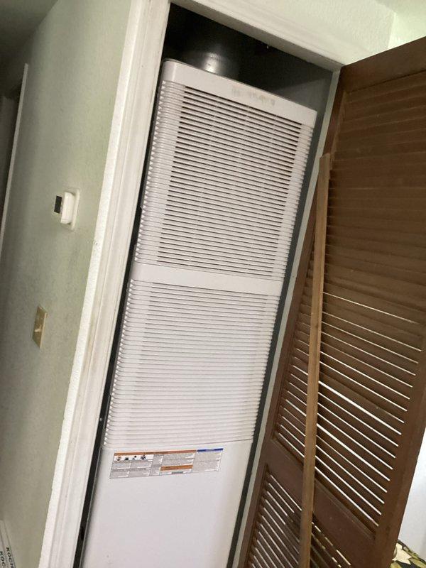 Completed annual cooling maintenance on vertical HVAC unit installed in closet configuration. Performed comprehensive system inspection including checking refrigerant levels, cleaning condenser coils, testing thermostat operation (Honeywell Home digital unit reading 74°F), verifying airflow through louvers, and replacing 16x20x1 air filter. All components functioning properly with no issues identified during routine preventative maintenance visit.