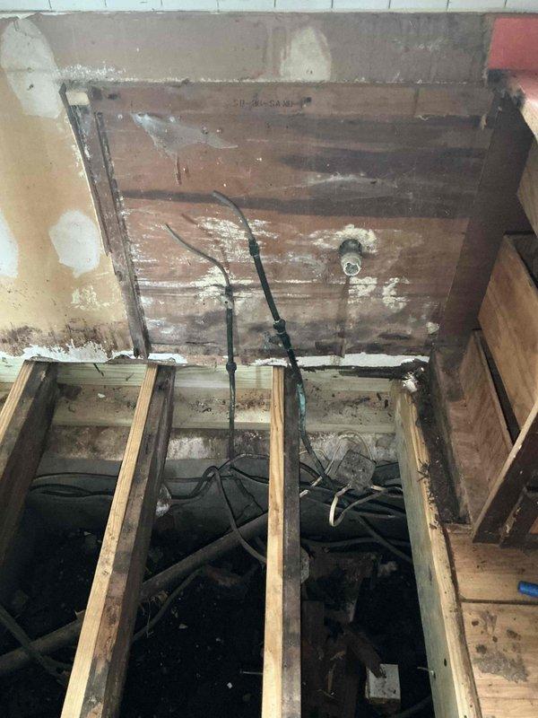 Conducted comprehensive plumbing assessment for complete residential gut and remodel project requiring full plumbing system replacement. Evaluated existing infrastructure including exposed floor joists with accessible basement/crawl space area and existing bathroom shower installation with standard fixtures. Documented current conditions of water supply lines, drain waste vent system, and fixture connections to provide accurate scope of work for complete plumbing system installation throughout the residence.