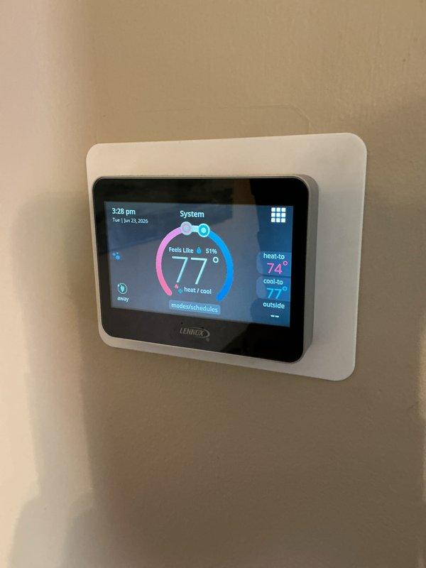 Completed routine cooling maintenance on Lennox system. Inspected outdoor condensing unit, verified proper operation of all components, and checked thermostat settings showing system in standby mode at 77°F cooling setpoint. Unit operating within normal parameters with no issues identified.
