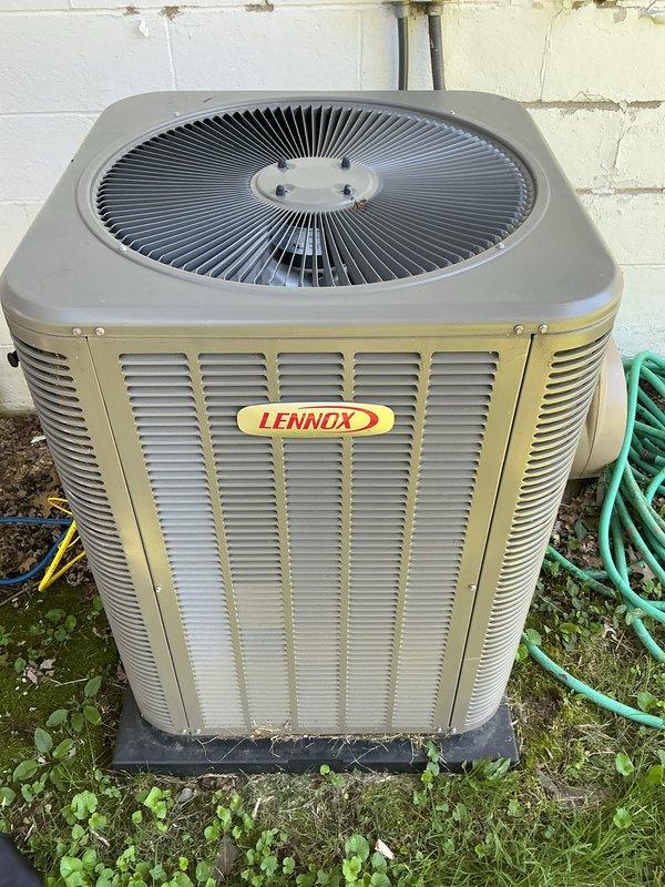 Completed routine cooling maintenance on Lennox system. Inspected outdoor condensing unit, verified proper operation of all components, and checked thermostat settings showing system in standby mode at 77°F cooling setpoint. Unit operating within normal parameters with no issues identified.