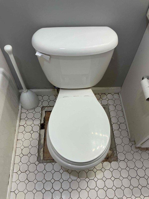 Responded to report of water staining on ceiling below bathroom. Upon inspection, identified active leak originating from toilet supply line connection above ceiling. Cut access opening in ceiling to expose plumbing components and confirmed leak source at compression fitting with degraded gasket. Replaced faulty gasket and compression fitting, tested system under pressure to verify proper seal and confirm leak resolution.