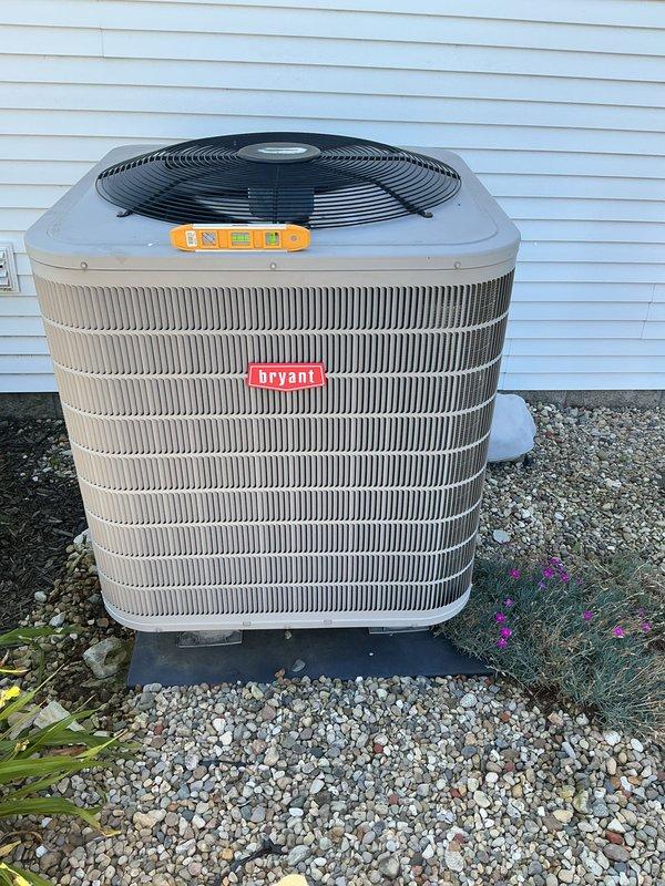 Completed basic monthly cooling maintenance on Bryant air conditioning system. Performed standard inspection of outdoor condensing unit, verified proper operation of compressor and condenser fan motor, checked refrigerant levels, and inspected electrical connections. Confirmed Lennox thermostat displaying proper temperature readings and functioning correctly in cooling mode at 74°F setpoint. Unit operating within normal parameters with no issues identified.