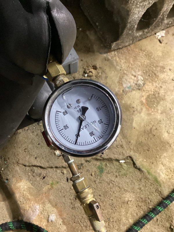 Responded to no cooling complaint with thermostat alert on ClimateMaster geothermal system. Performed system diagnostics and vacuum pressure testing to verify refrigerant circuit integrity and proper system operation. Confirmed unit returned to normal cooling function with thermostat displaying 66° and system operating without alerts.
