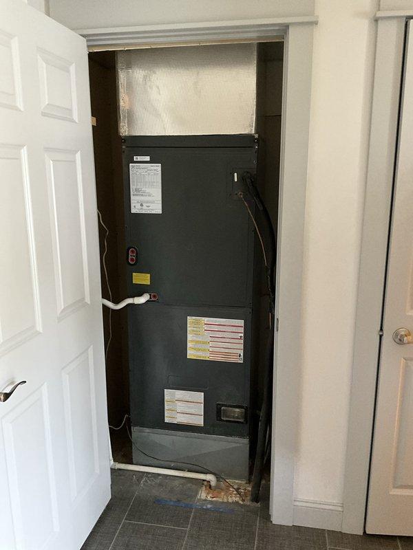 Responded to service call for non-operational HVAC system with refrigerant leak using obsolete coolant type no longer manufactured. Provided comprehensive estimate for complete system replacement including new air handler unit and associated electrical work. Documented existing electrical panel configuration showing current breaker arrangement and wiring connections, as well as existing air handler installation in mechanical closet with drain pan assembly.