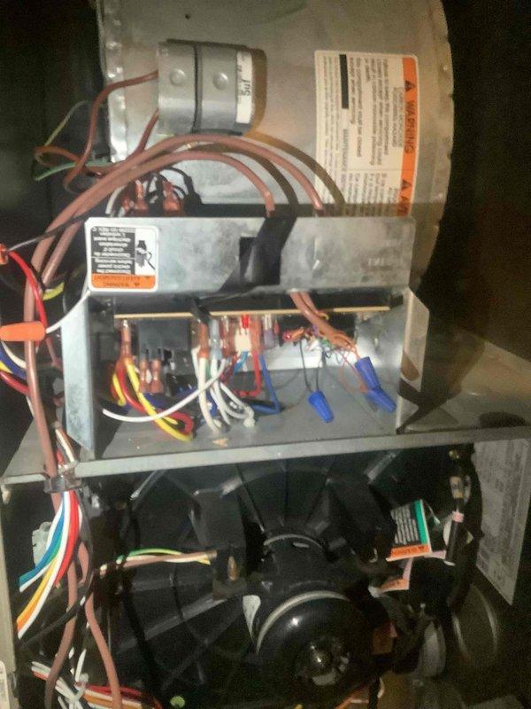 Responded to service call for thermostat malfunction reported over several days. Performed diagnostic inspection of HVAC system including control board, wiring connections, and electrical components. Verified proper operation of furnace control module, checked status indicator LED function, inspected wire terminal connections at control board, and examined blower motor assembly and compressor unit for proper integration with thermostat controls.