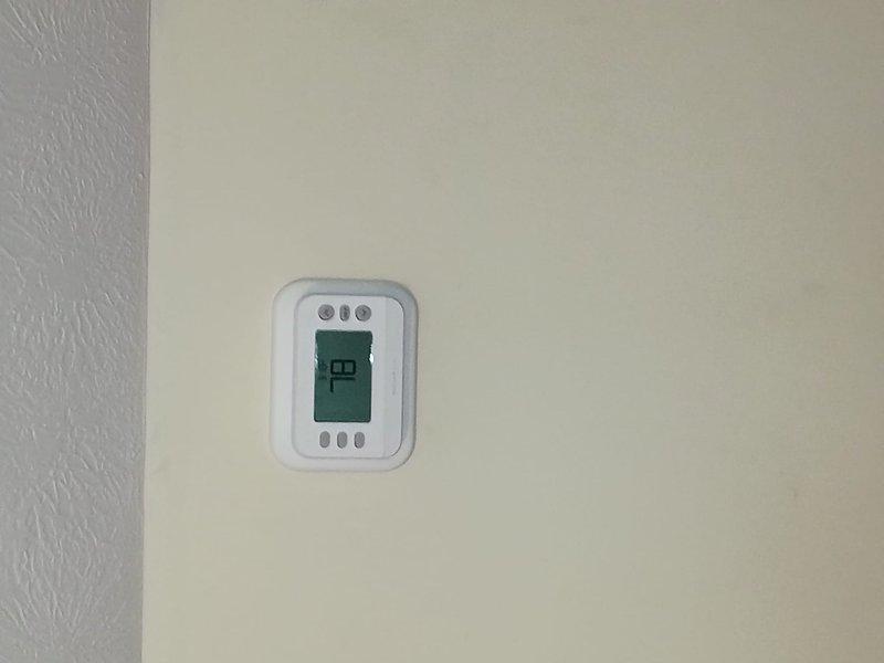 Completed full installation of Lennox heat pump system. Installed new digital thermostat with programmable controls, verified proper temperature display and calibration showing 70°F setpoint. Conducted system startup and performance testing, confirming supply air temperature of 76.4°F during operational checks. All equipment installed to manufacturer specifications and verified operational.