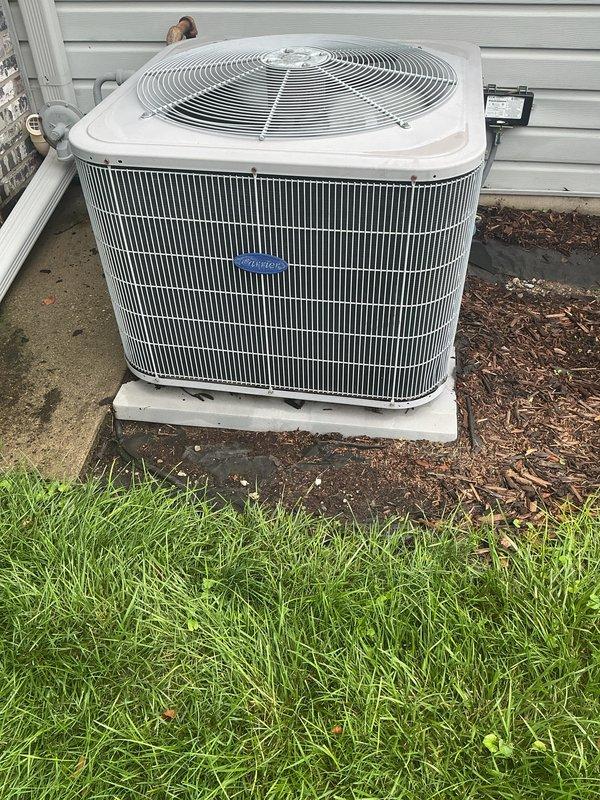 Completed routine cooling maintenance on residential Carrier split system. Replaced expired 20x25x4 air filter and cleared filter alert from Carrier thermostat. Inspected outdoor condenser unit, verified proper operation, and confirmed adequate airflow clearance around equipment.