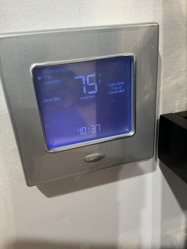 Completed routine cooling maintenance on residential Carrier split system. Replaced expired 20x25x4 air filter and cleared filter alert from Carrier thermostat. Inspected outdoor condenser unit, verified proper operation, and confirmed adequate airflow clearance around equipment.