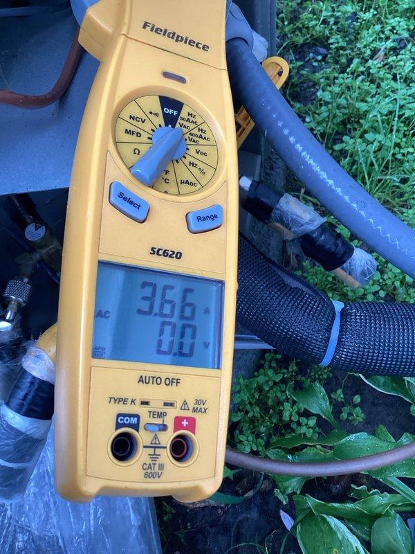 # HVAC Maintenance - Cooling System Service

Completed annual cooling maintenance visit on residential HVAC system. Performed comprehensive system inspection and testing of all major components to ensure proper operation for the cooling season.

## Work Performed

Conducted thorough visual inspection of outdoor condensing unit and indoor air handler components. Checked all electrical connections and tightened as needed. Verified proper voltage and amperage readings at the unit using calibration-tested digital multimeter. Measured capacitor microfarad ratings to confirm capacitors are operating within manufacturer specifications - readings showed 366 MFD, indicating proper capacitor function.

Inspected refrigerant lines and insulation for signs of wear or damage. Noted blue insulated suction line in good condition with no visible deterioration. Tested system pressures and temperatures to verify adequate refrigerant charge and proper heat exchange.

Replaced air filter with customer-pro