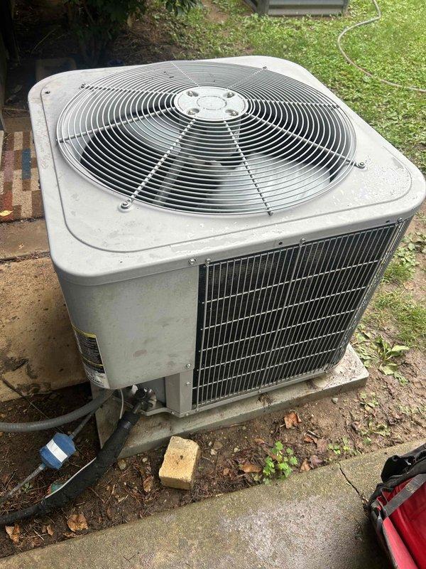 Responded to no cooling complaint on residential air conditioning system. Upon arrival, inspected outdoor condensing unit and found system operational but performing electrical diagnostics. Removed access panel and inspected electrical components including contactor, capacitor, and wiring connections. Verified capacitor rated at 6.0 MFD and checked all terminal connections for proper voltage and secure mounting. Inspected condenser coil fins and noted unit showing normal wear for age. All electrical connections tested and secured, system restored to normal cooling operation.